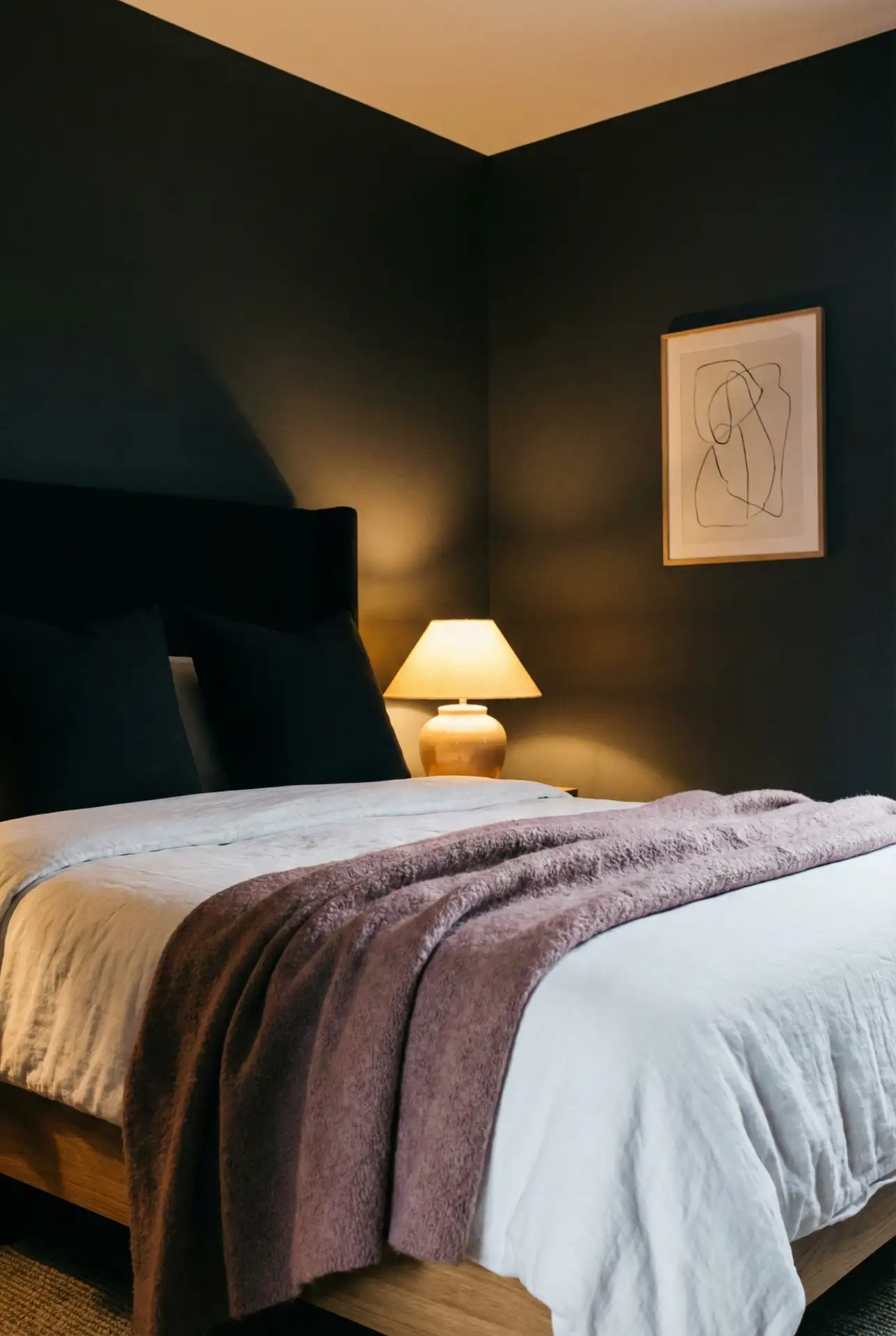 Dark And Classy Contrast With Black Headboard And Soft Mauve Accents 2