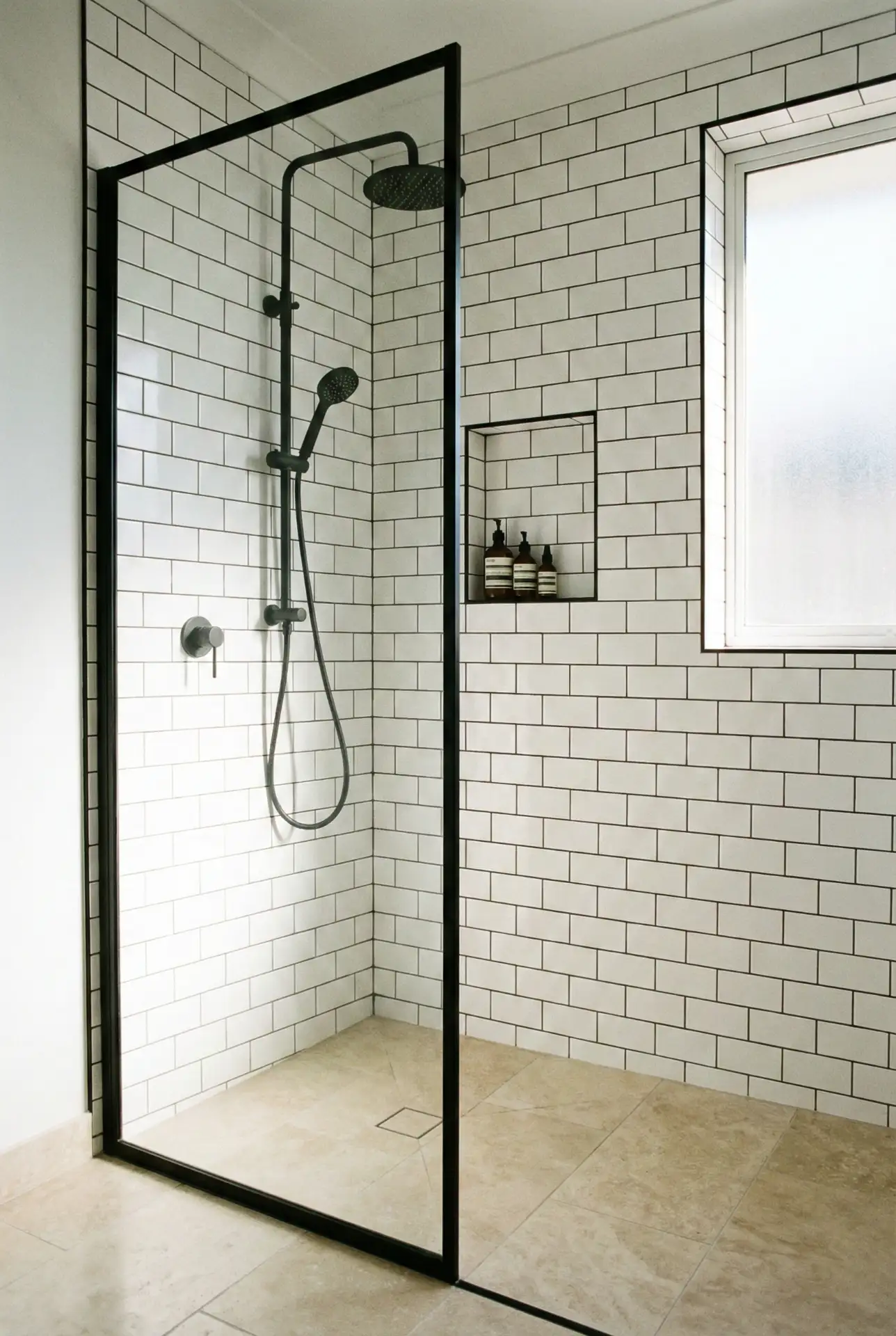 Black-Framed Shower Door With White Tile Contrast 1