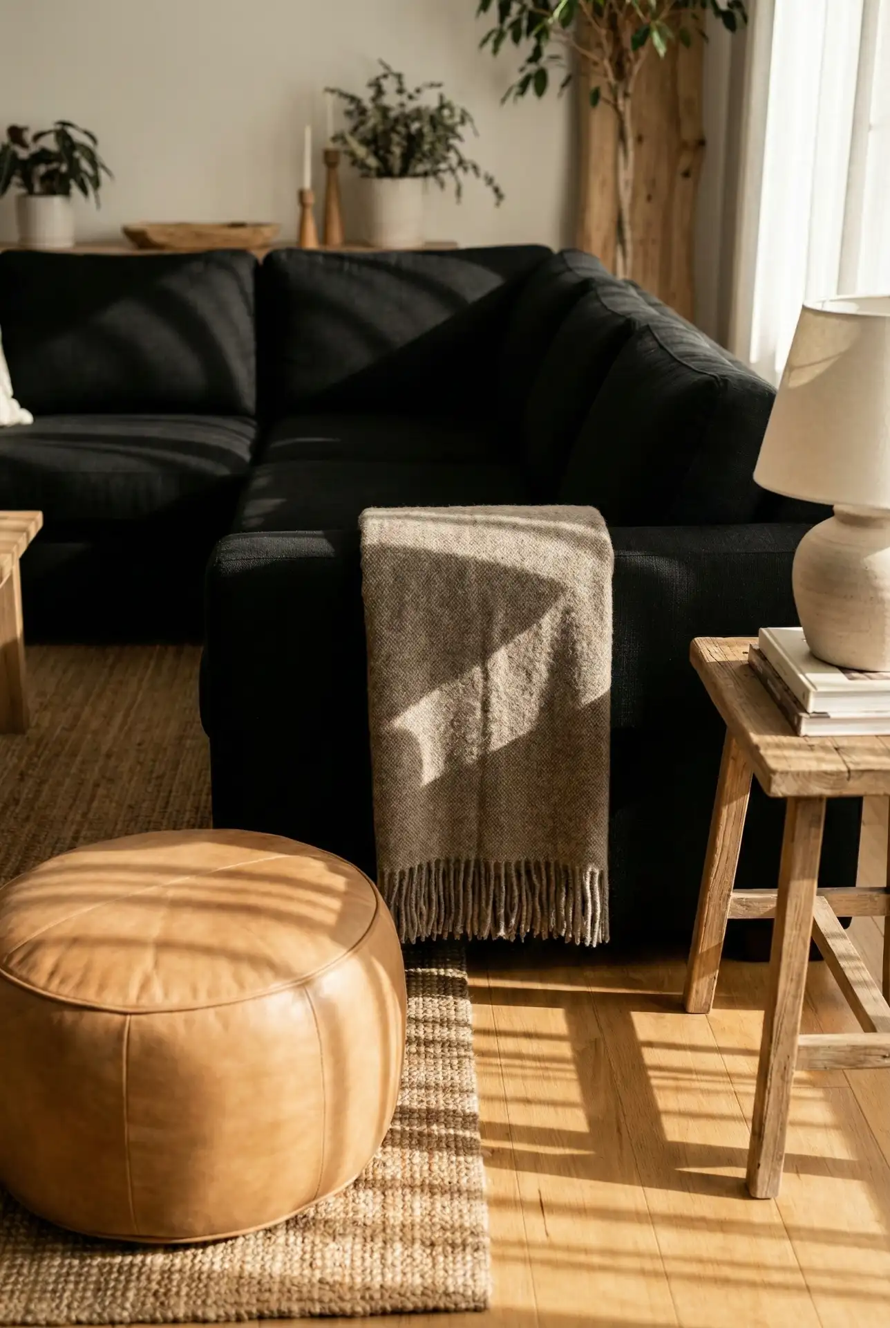 Black Sectional With Tan And Taupe Softening Layers 1