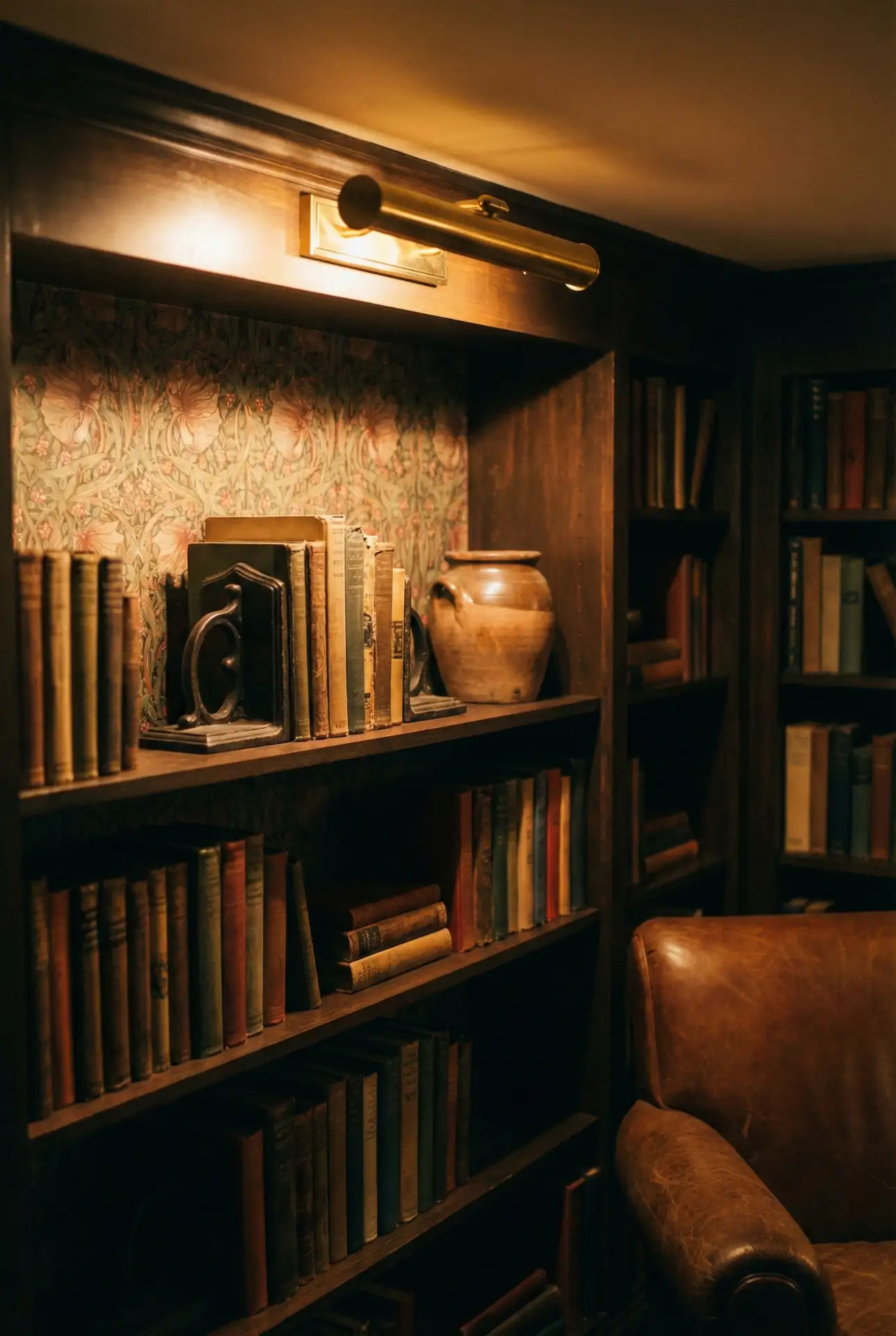 Vintage Cozy Library With Wallpaper Backing And Picture Lights 2
