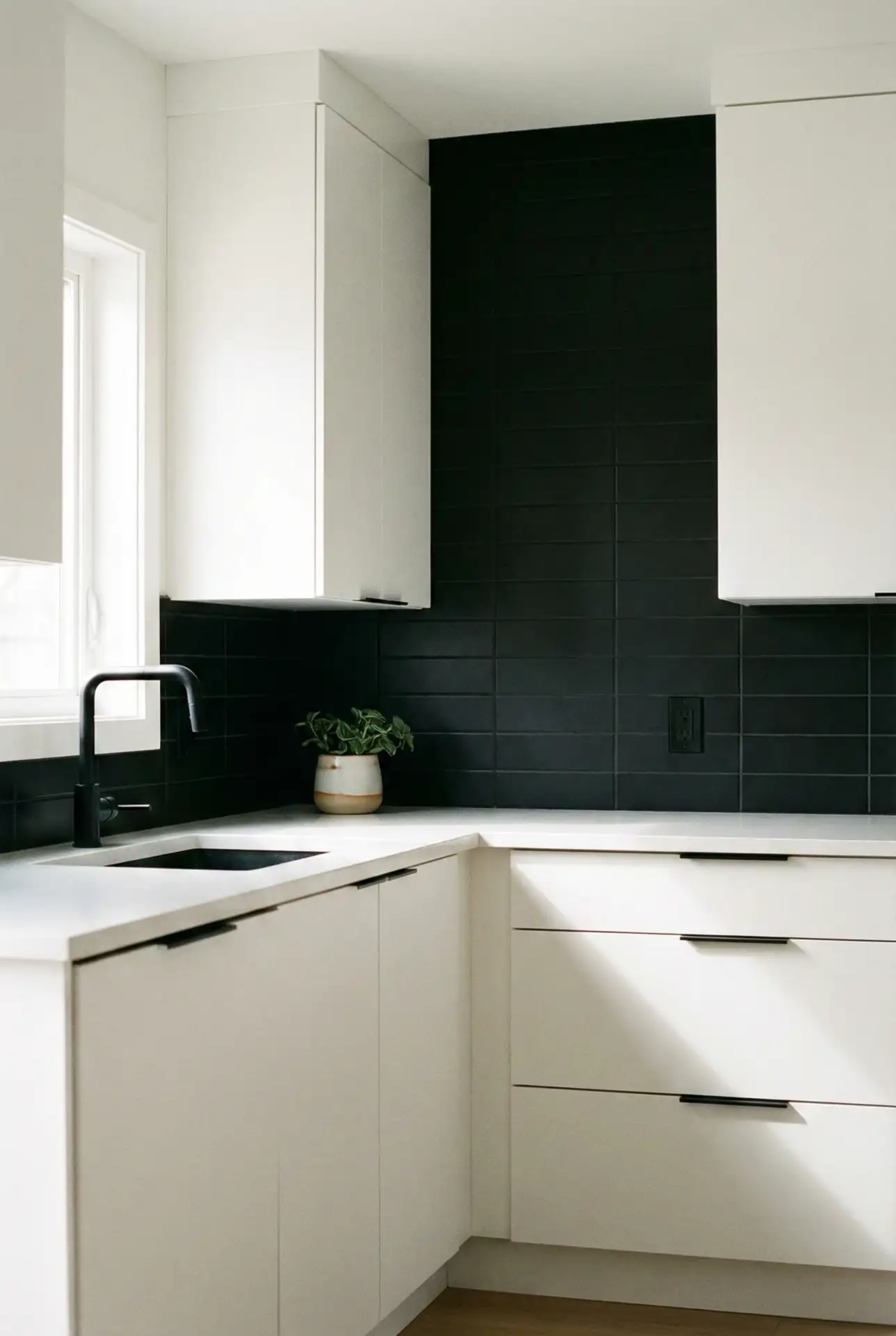 White Slab Cabinets With A Graphic Black Backsplash 1