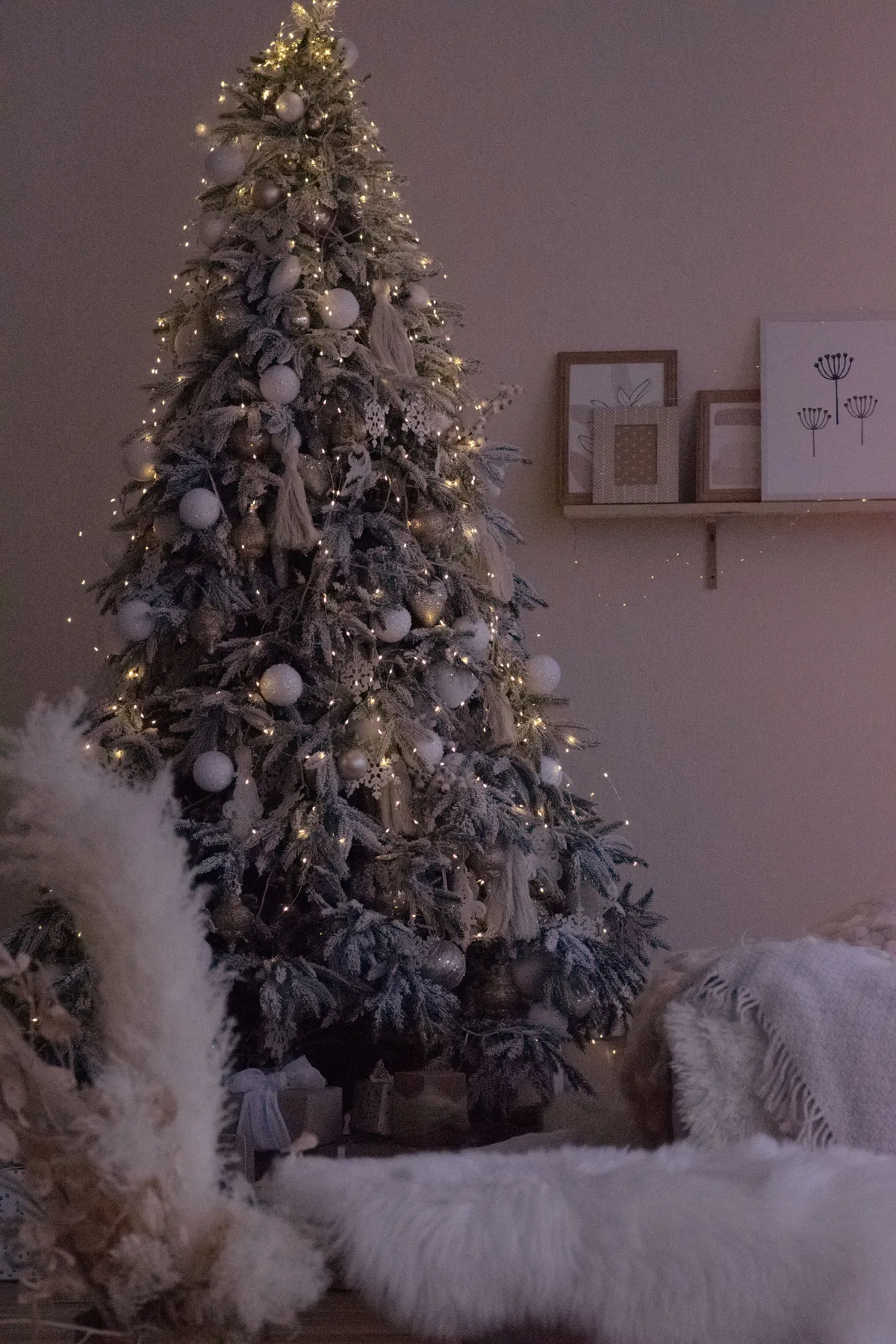 A beautifully decorated Christmas tree illuminated softly in a cozy indoor setting. Perfect festive ambiance.