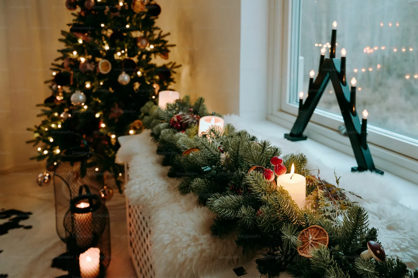 A christmas tree is next to a window sill - Photo on Unsplash+