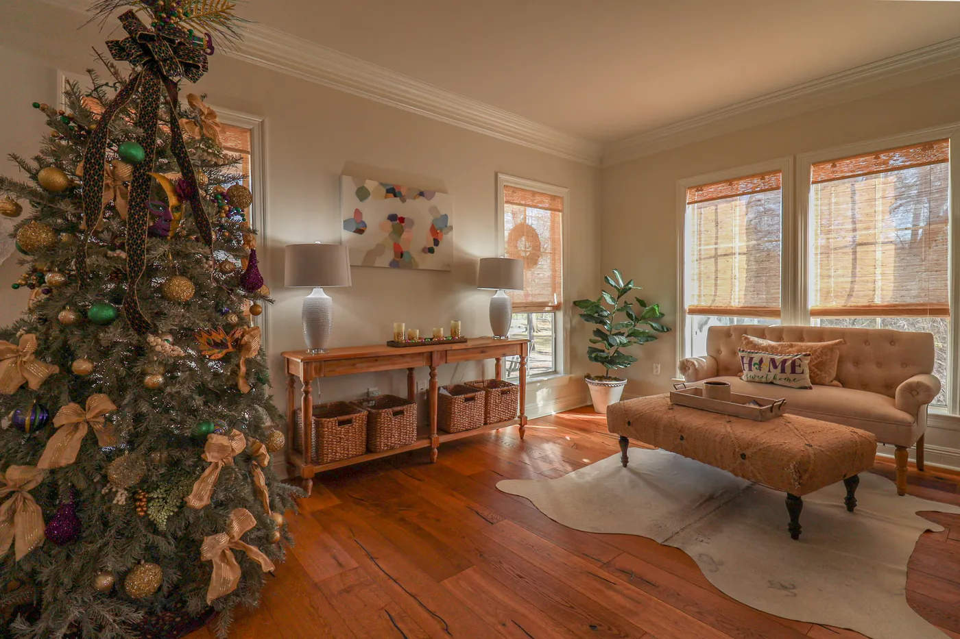 A decorated christmas tree in a cozy living room