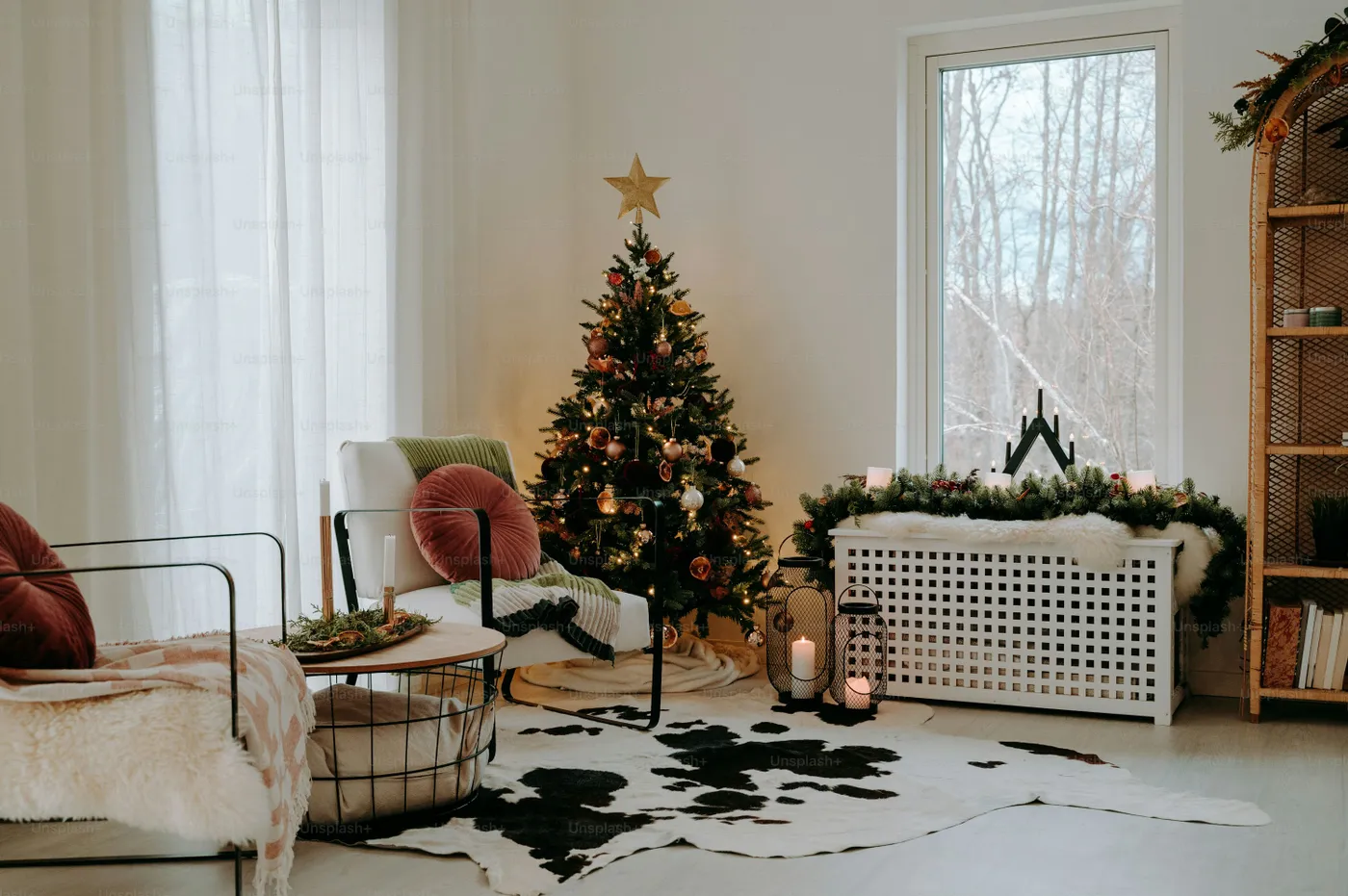 A living room filled with furniture and a christmas tree - Photo on Unsplash+