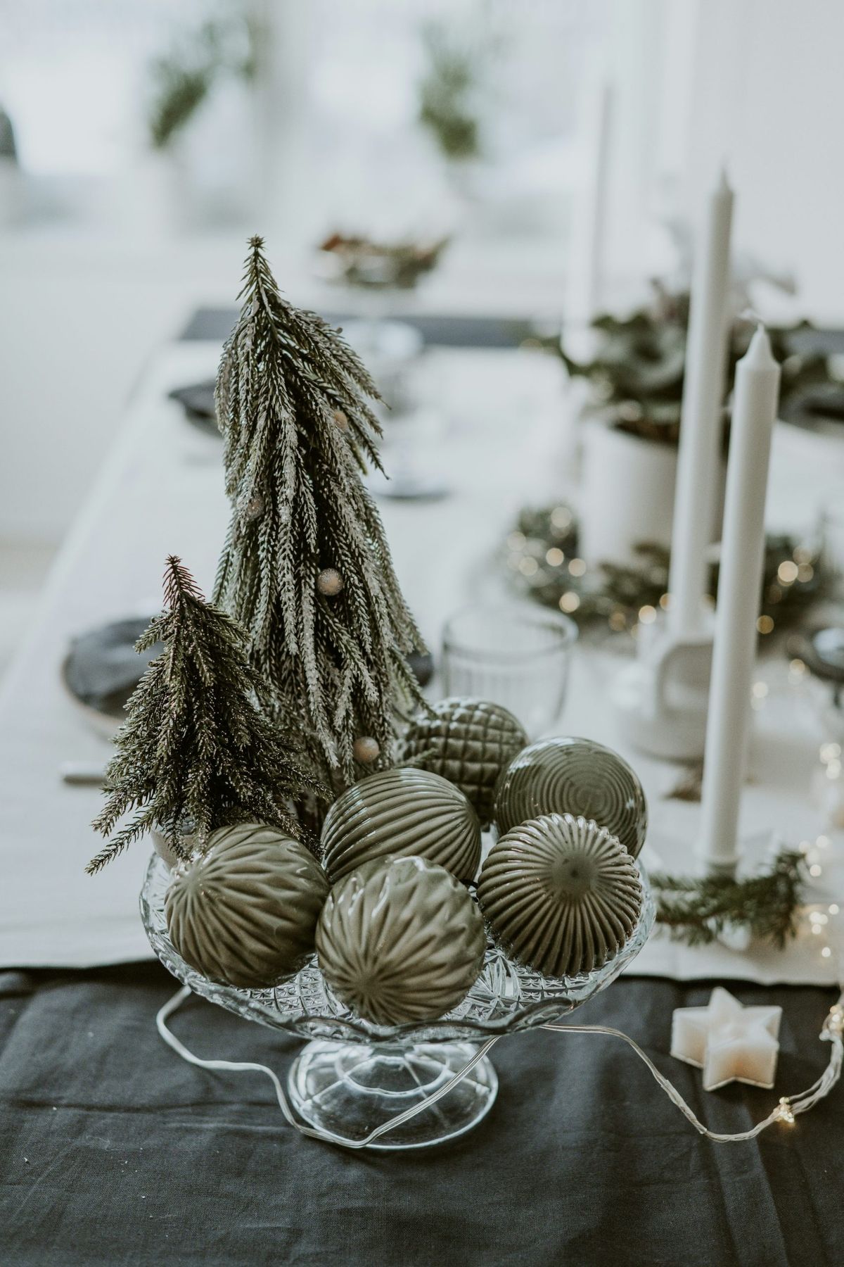A table topped with a glass bowl filled with ornaments - Free Photo on  Unsplash