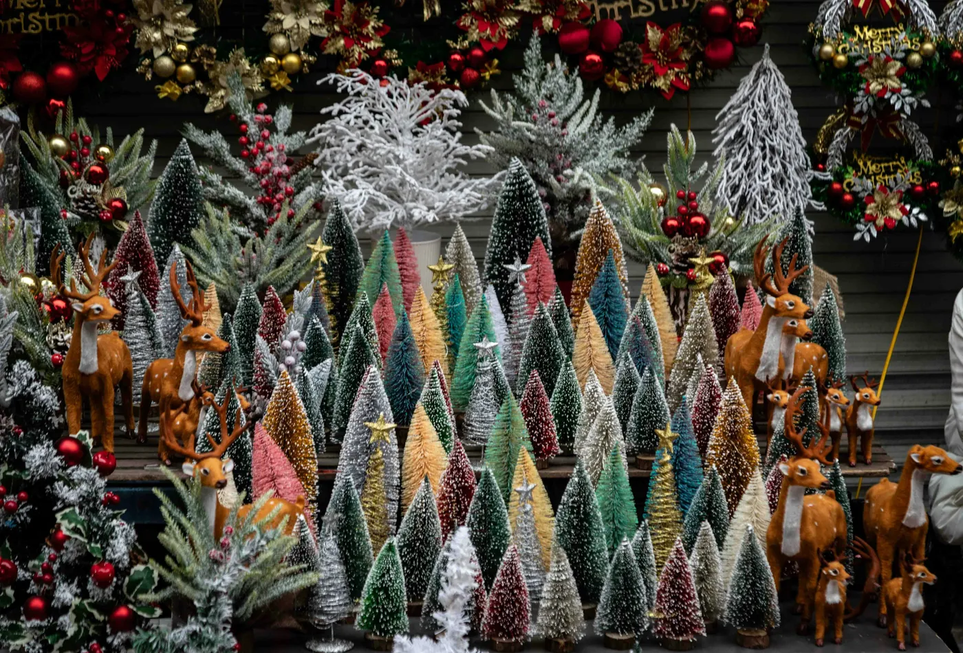 Assortment of colorful miniature christmas trees and deer decorations - Free Photo on Unsplash