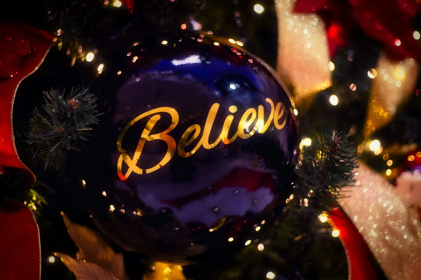Dark blue christmas ornament with 'believe' written on it - Free Photo on  Unsplash