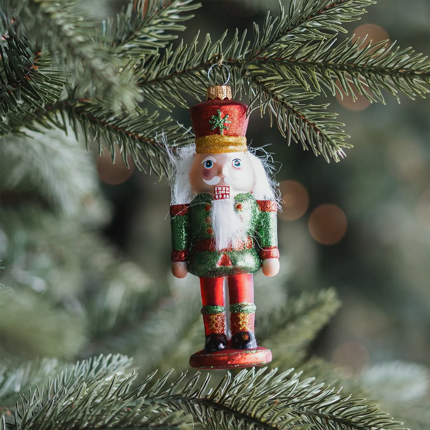 Green and red glass nutcracker Christmas ornament 13 cm