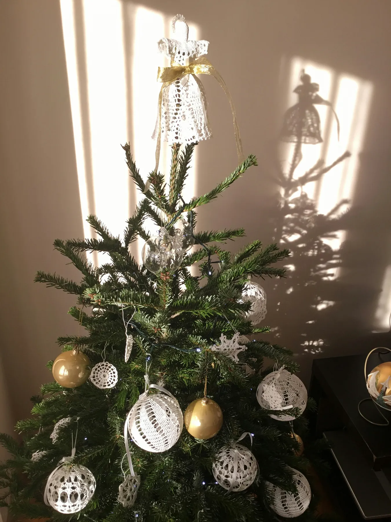 green and white christmas tree with baubles