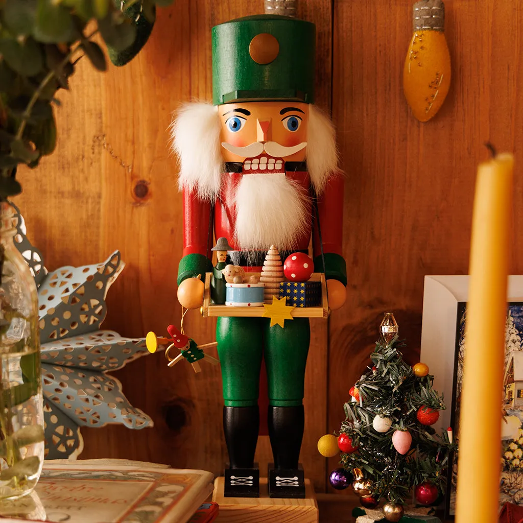 Handmade Large Wooden Nutcracker Carrying a Tray of Small Wooden Toys