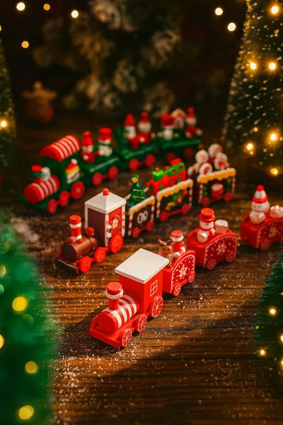 Holiday Decor Mini Christmas Train A Close-up Shows A Beautifully Detailed Miniature Christmas Train With