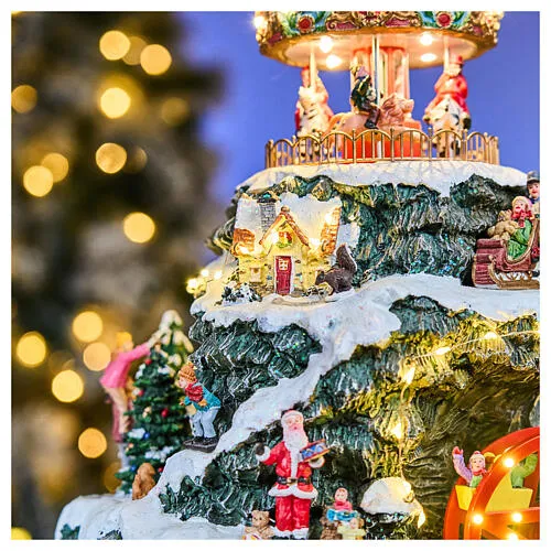LED mountain Christmas village carousel music motion transformer, 35x35x50 cm | online sales on HOLYART.com