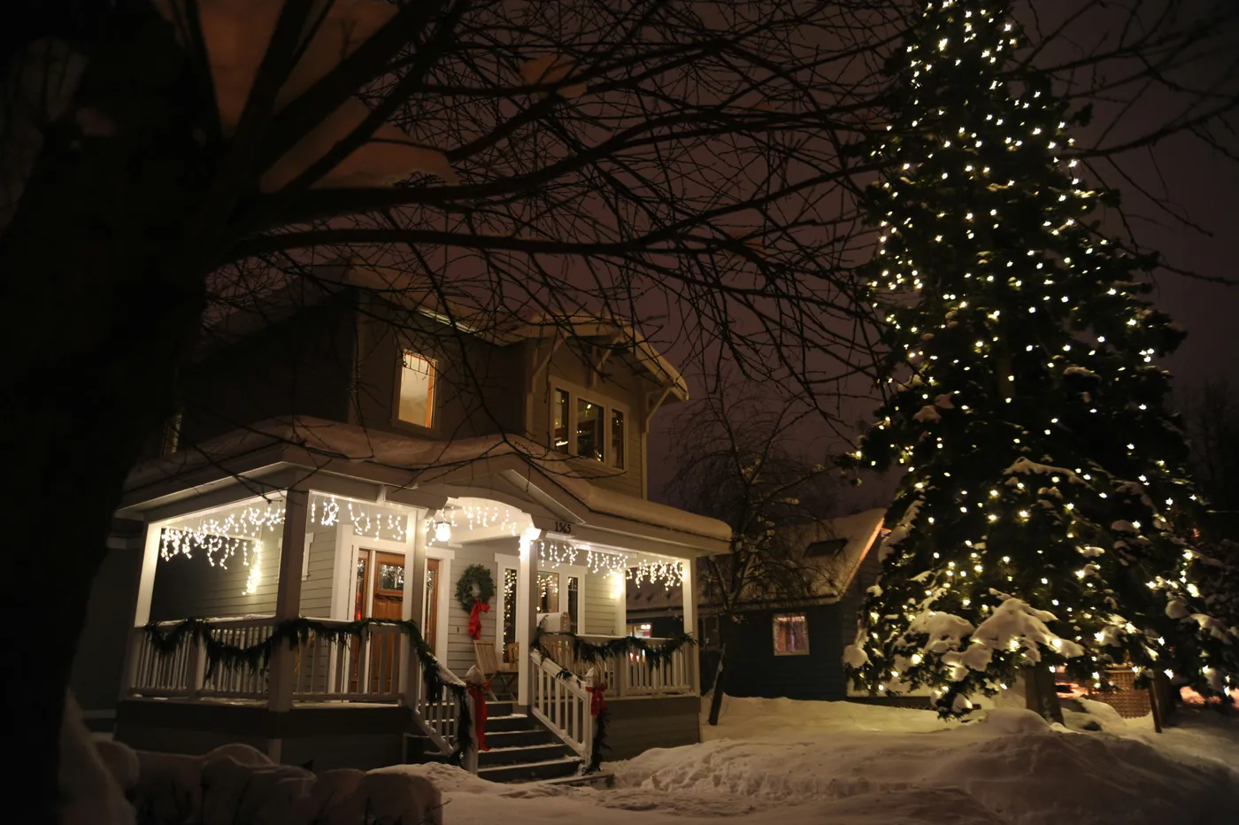 One winter while walking my dog in Anchorage, Alaska, after visiting my mom in the Pioneer’s Home, I happened upon this delightful Christmas scene on Christmas eve, a huge spruce tree lit up with whit