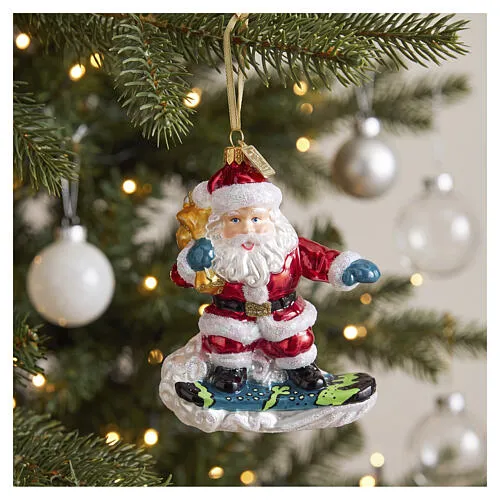 Santa Claus on a Snowboard blown glass Christmas tree ornament